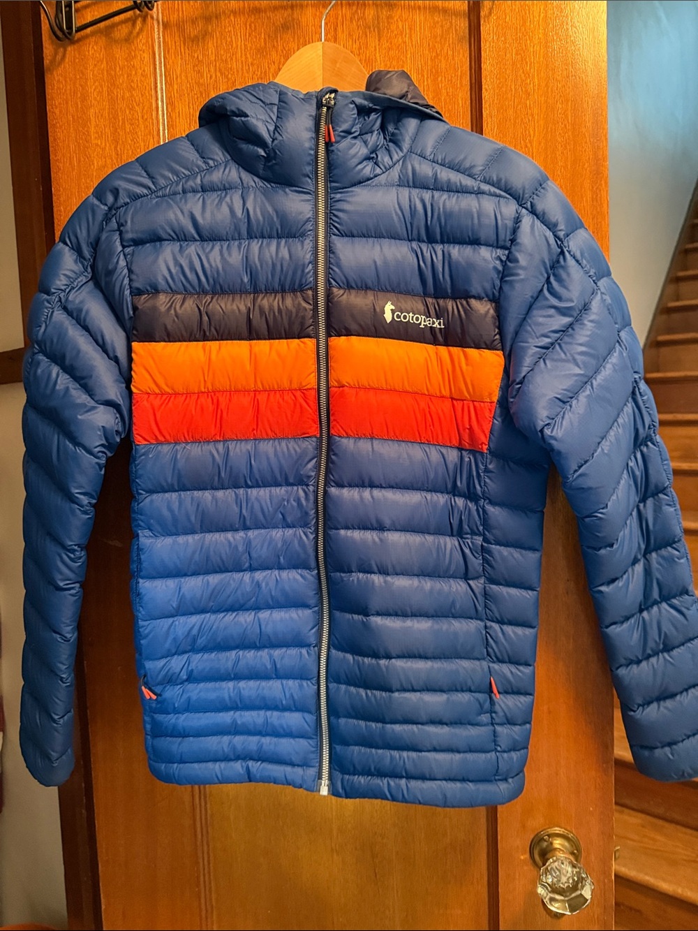 cotopaxi Men’s Blue Hooded Puffer Jacket with Orange & Red Stripes